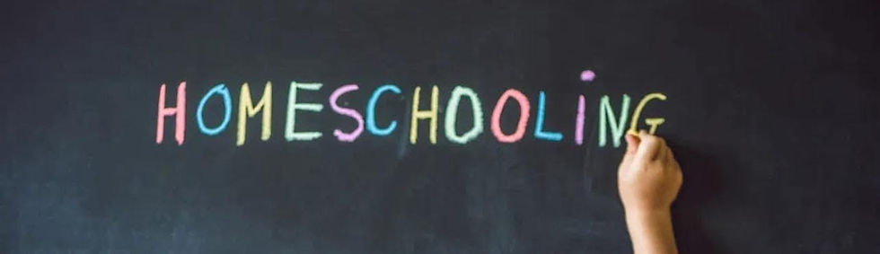 Child's hand writes "HOMESCHOOLING" in colorful chalk on a blackboard, creating a vibrant, educational atmosphere.