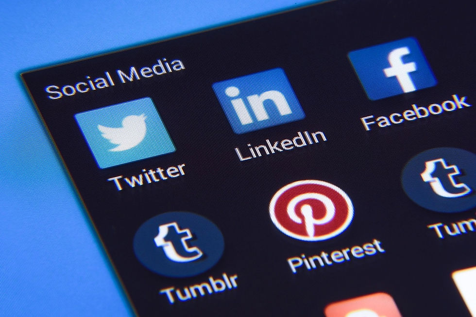 Icons of social media apps, including Twitter, LinkedIn, and Facebook, on a screen with a blue background. Text reads "Social Media."
