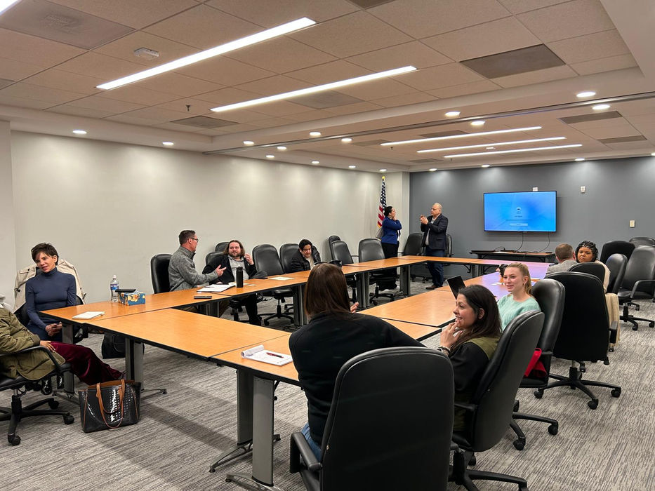 Rahul Karan Sharma engaging participants in a small group leadership exercise using the CLIMB framework.