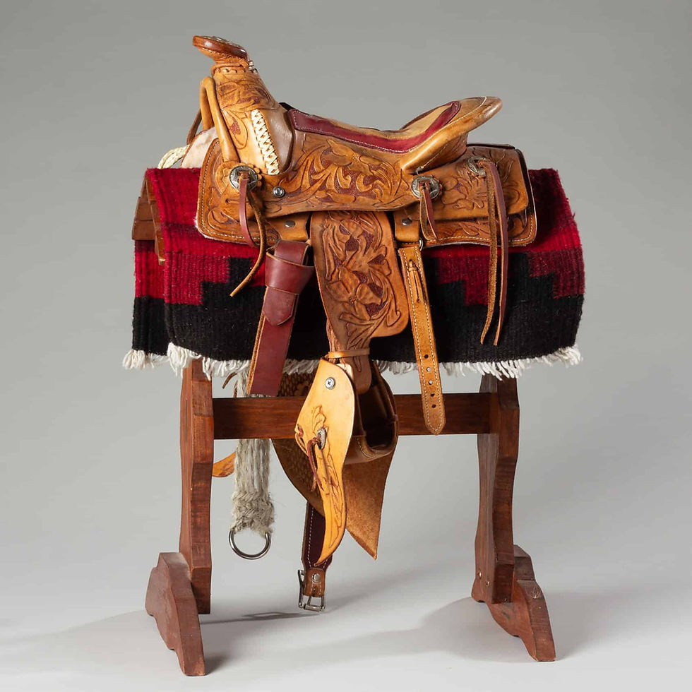 Vintage salesman sample Western saddle marked with crown, 1960s–70s.