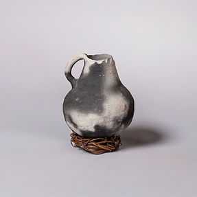 Very early small neck banded pot with suspension logs
