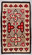 Featuring a large border with morning star design elements, and an interior with traditional crossed lightning bars with stepped terminals, abstract whirling log motifs, aniline red, black, grey, and natural white Ca. 1920s