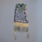 Antique Apache strike-a-lite bag, sinew-sewn with white and blue checkered beadwork, green top, and long tin fringe