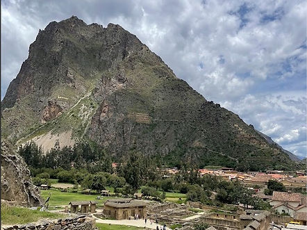 View of the Ollantaytambo valley with sections of the archaeological site visible on the hillside.