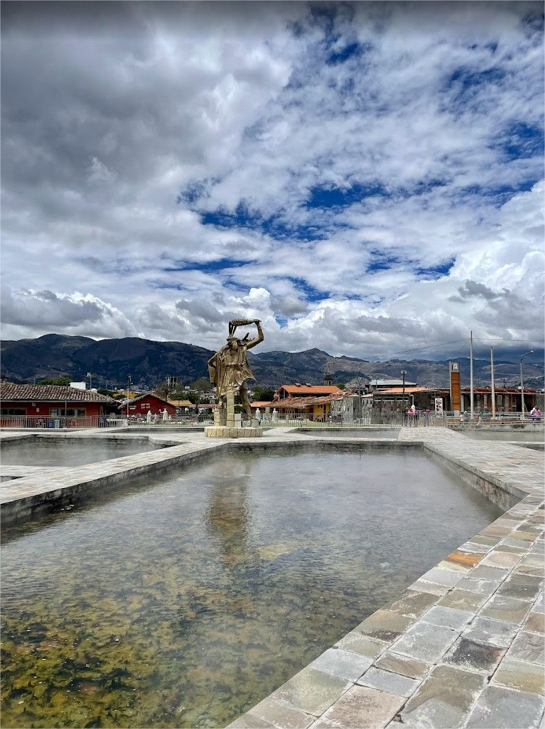 Hot springs pools and Inca statue in the main square of Baños del Inca in Cajamarca.