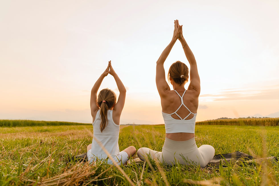 Mother and daughter practicing yoga poses in nature Healthy family image Parents and kids