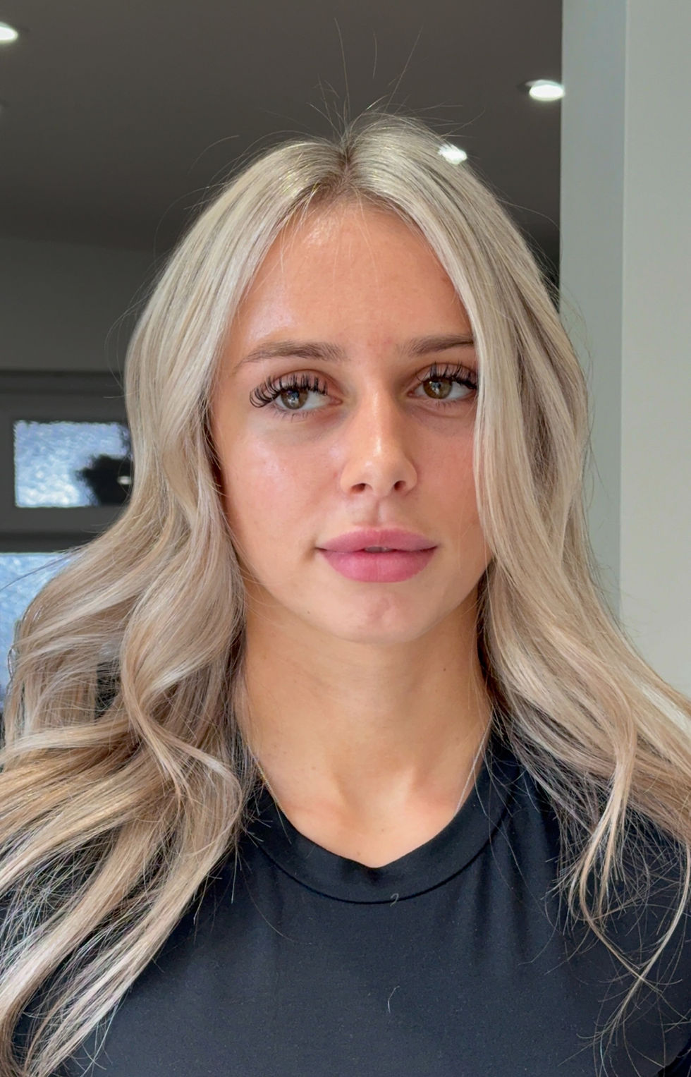 Woman with styled blonde hair by a hairdresser in Tonbridge