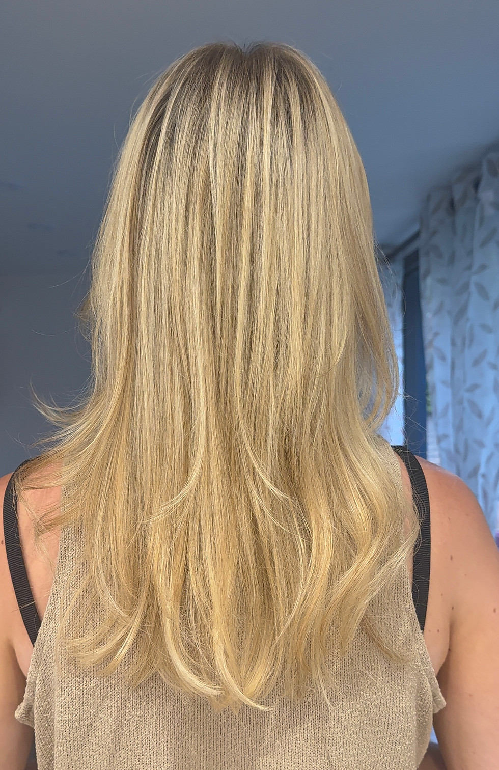 Healthy hair after treating blonde hair breakage.