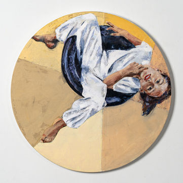 Woman reclines in white pants on a circular canvas