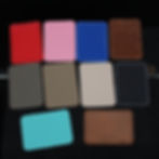 Thumbnail: Various colored cardholders arranged on a dark surface, showcasing product variety and design.