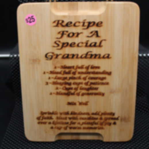 Wooden cutting board inscribed with Recipe For A Special Grandma, $25, and instructions.