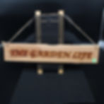 Thumbnail: Wooden sign displaying "The Garden Life" with natural rope and mesh background