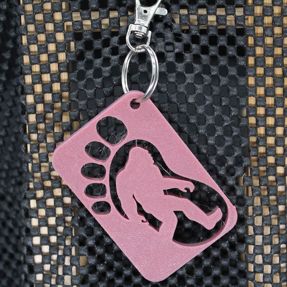 Pink Bigfoot keychain with a footprint design. Large 3D Printed Keychain. SpellBound LaserCraft LLC