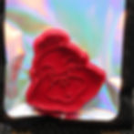 Thumbnail: Red face-shaped cookie cutter on iridescent background. SpellBound LaserCraft LLC
