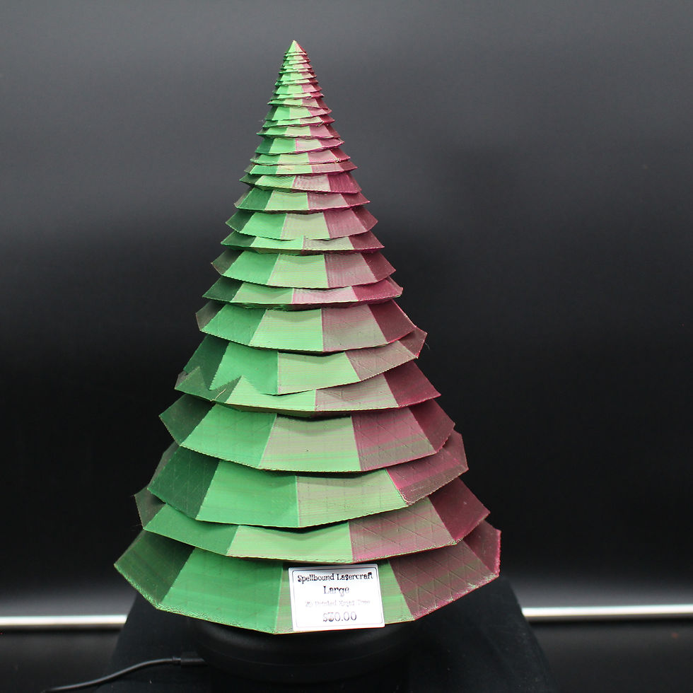 Green and red layered Christmas tree decoration on display SpellBound LaserCraft LLC