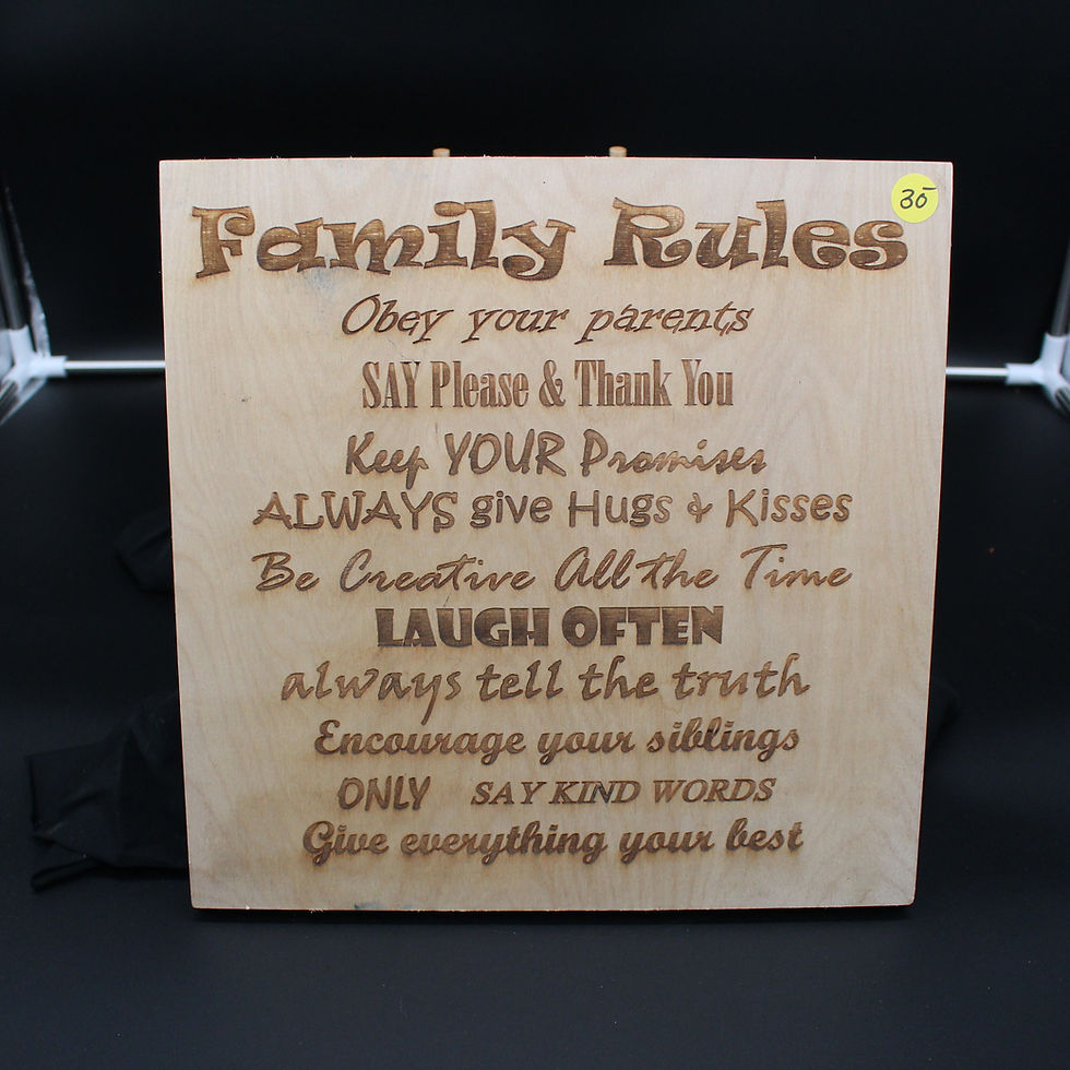Wooden sign reads Family Rules: Obey parents, laugh often, be kind.