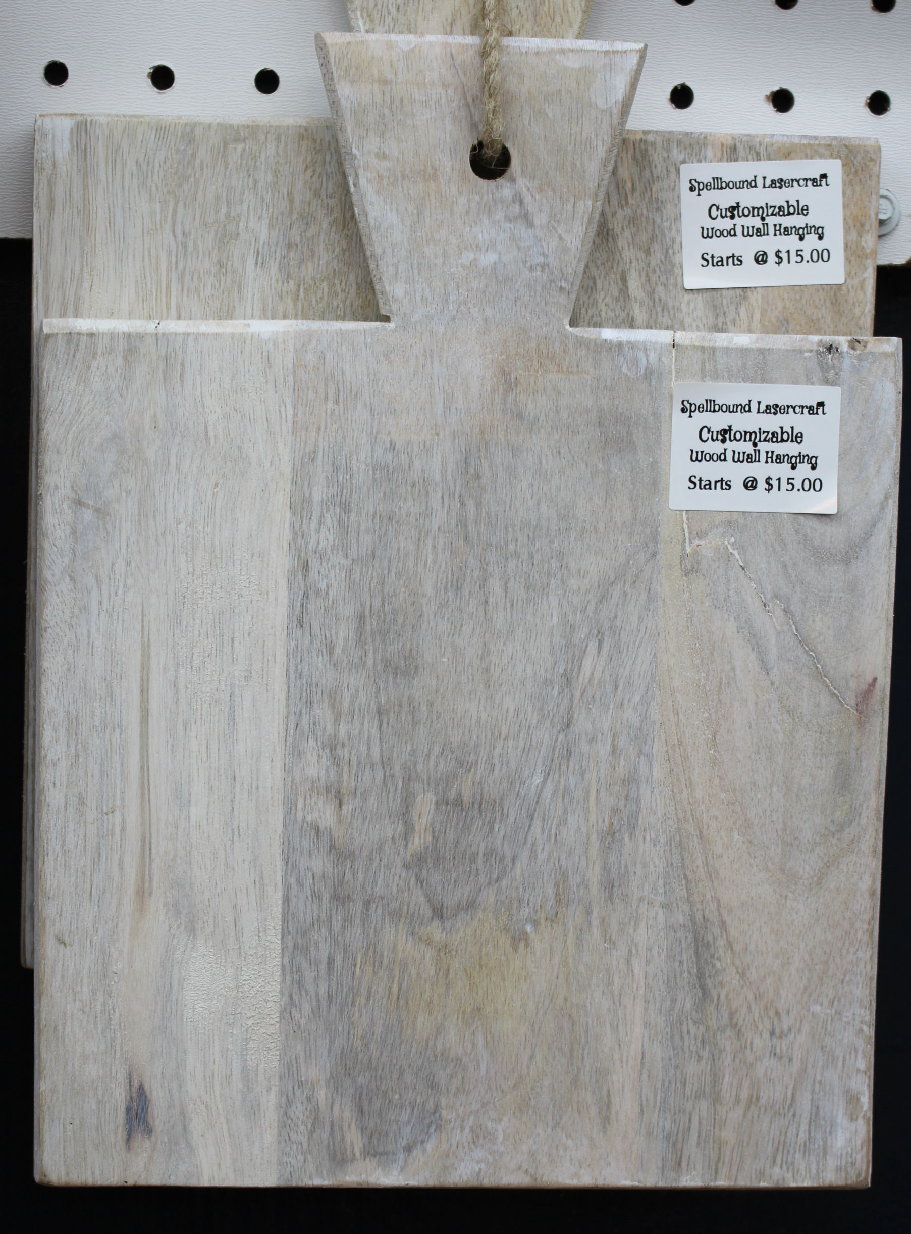 Cutting boards with text "SpellBound LaserCraft" and prices. Wood Wall Hanging.