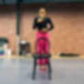 Isa Huembes (2) dances with an empty chair as Alexandra reflects about her sister Andrea,