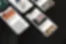 Varios teléfonos móviles mostrando diseños y textos sobre una superficie negra.
