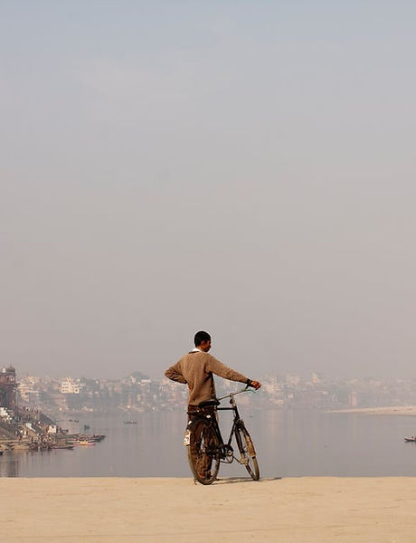 Man Holding Bicycle