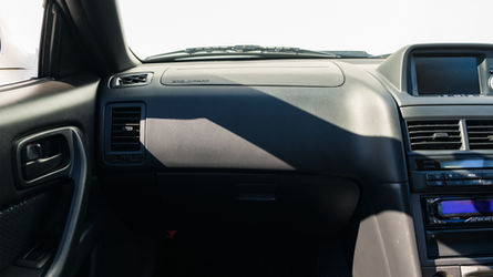 web-16x9_listing-images_Nissan-BNR34-VSpecII-White0029-interior-passenger-dashboard.png