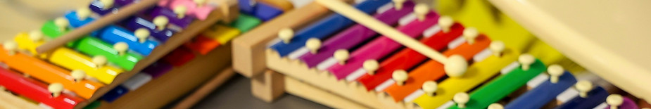 A collection of colorful handbells and x
