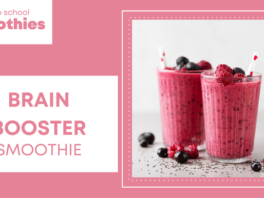 Two berry smoothies in glasses with straws sit on a table. Text reads: "Back to school Smoothies, BRAIN BOOSTER SMOOTHIE." Pink background.