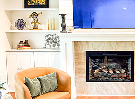 living room fireplace with custom built-in cabinetry