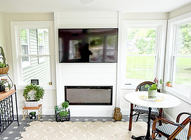 sunroom fireplace insert with custom shiplap wall