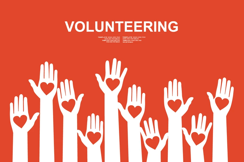 Volunteer hands with hearts