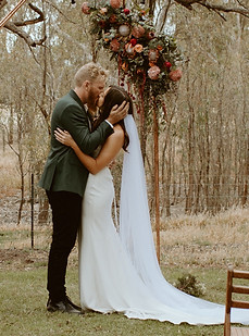 bride and grooms first kiss