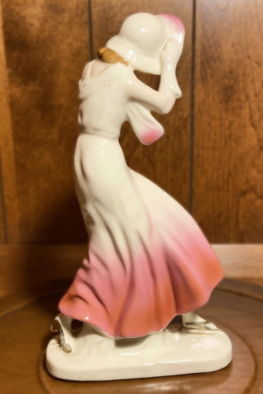 Thumbnail: Vintage Porcelain Figurine of Elegant Woman in Flowing Pink Dress and Bonnet