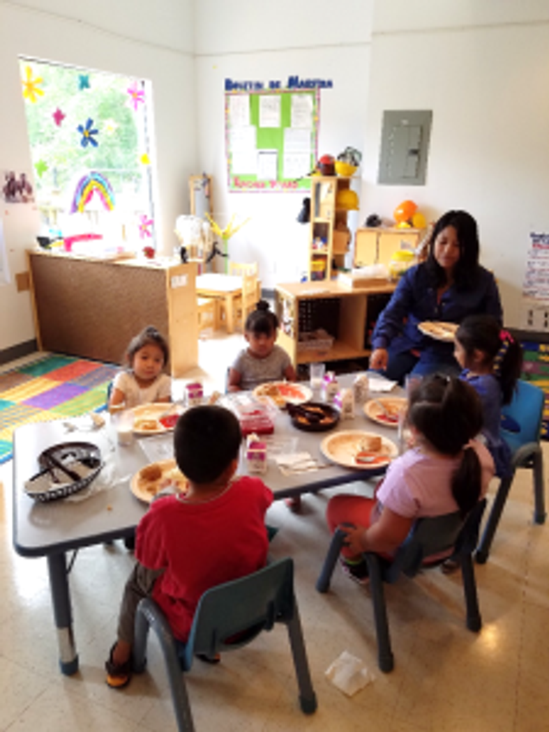 Children enjoy delicious and healthy snacks prepared by our kitchen staff.