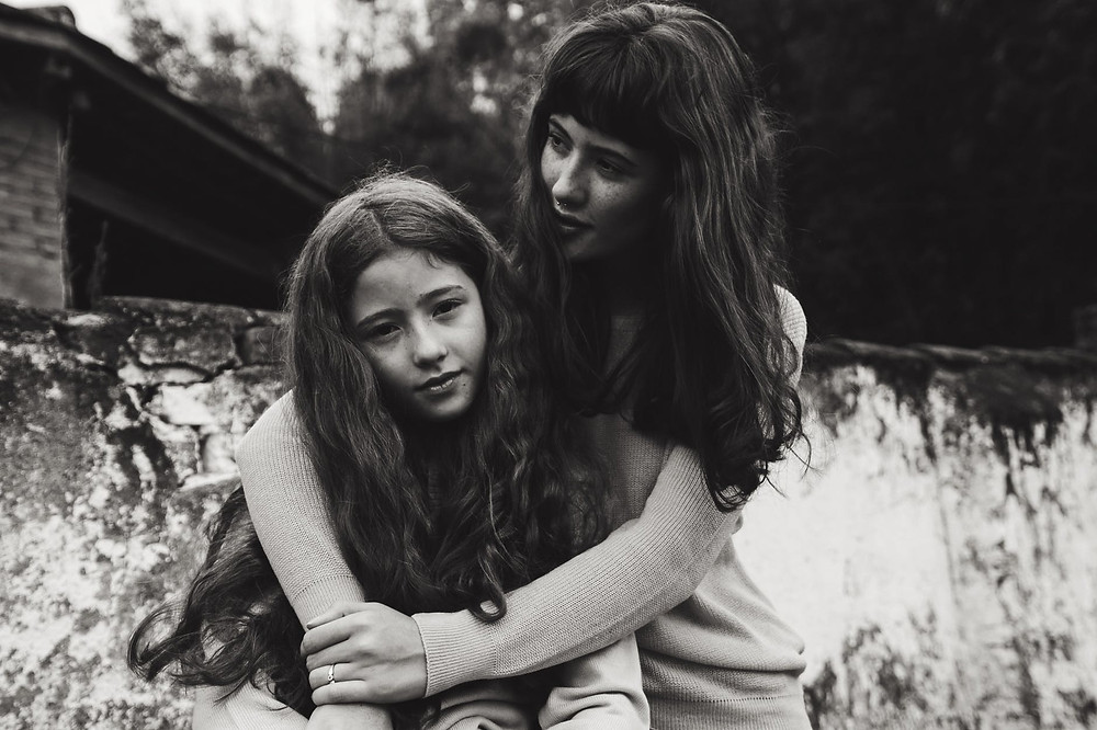 grayscale photo of woman and girl with long hair