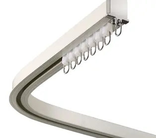 Curved drapery track system for custom curtains