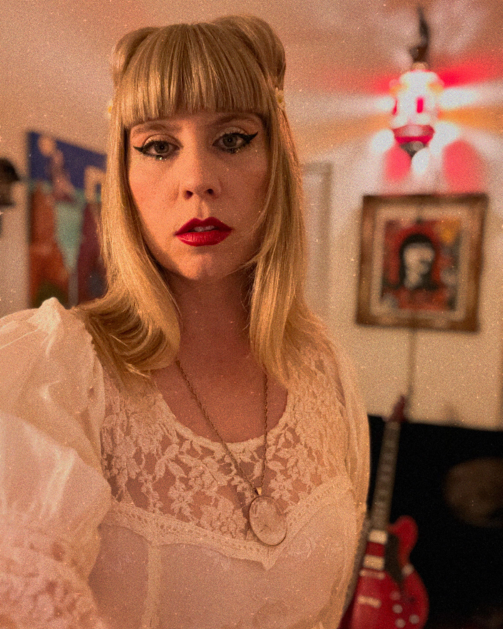 Naomi Stinnett in room with art in the background