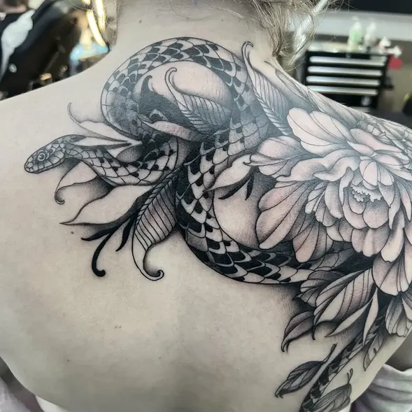 Large floral cover up black & grey tattoo