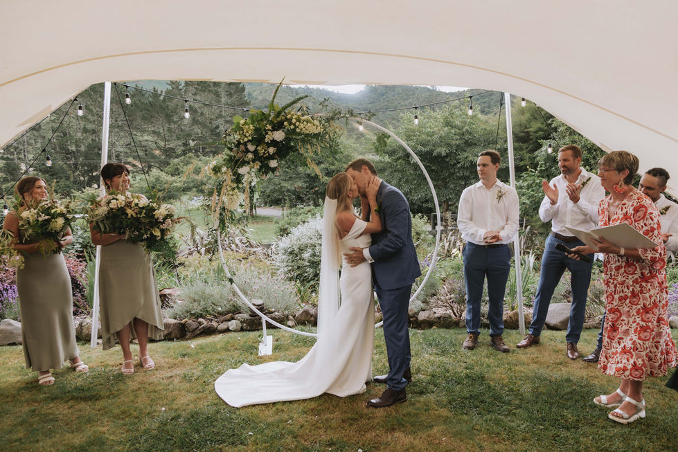 Gorgeous wedding arch flowers in lush greens and and country whites.