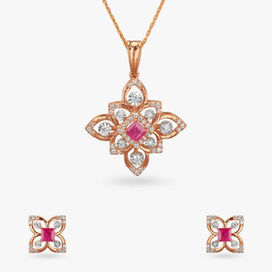 Elegant floral pendant and earrings set featuring 0.50 - 1.00 carat natural diamonds and radiant rubies—perfect for festivals, celebrations, and timeless luxury.
