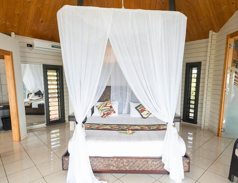Luxurious bedroom with four-poster bed and canopy