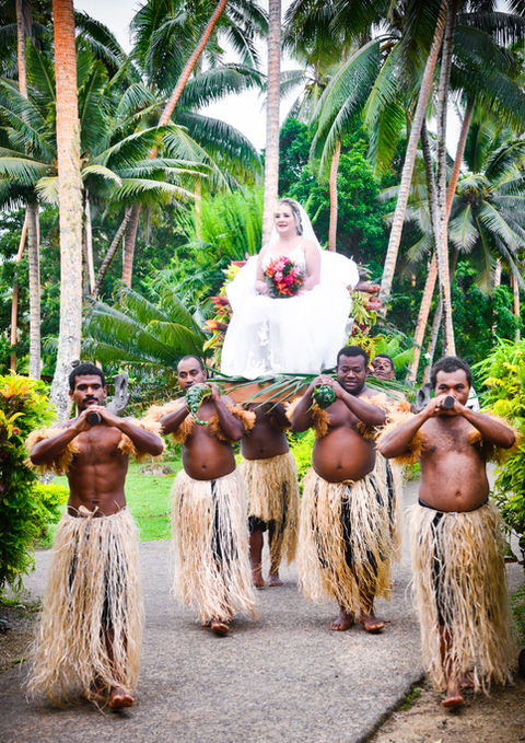 Bride carried by men in traditional wear, wedding in tropical setting, Gecko Digital Fiji
