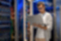 Man checking wiring on a server