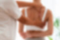 Teenage patient getting back massage from mature osteopath at rehabilitation center