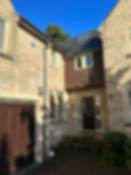 Exterior of home with alarm system box fitted to the wall