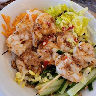 Noodle salad bowl with BBQ prawn skewers