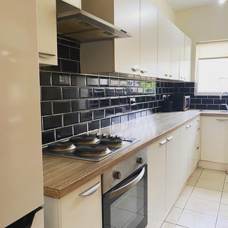 Kitchen with black tiles