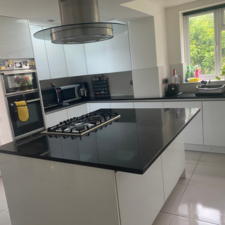 Kitchen with black work surface