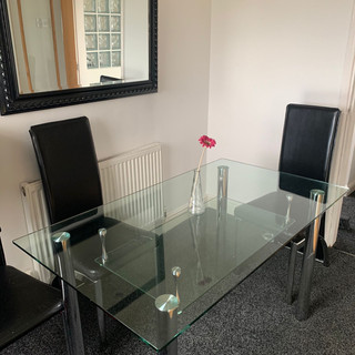 Glass dining table with chairs