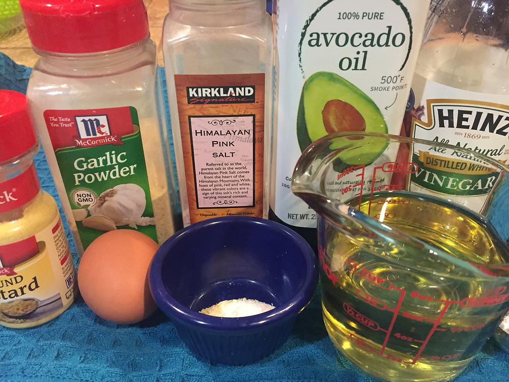 Ingredients for mayonnaise egg mustard garlic powder Himalayan pink salt white vinegar avocado oil