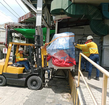 Forklift driver loading large package